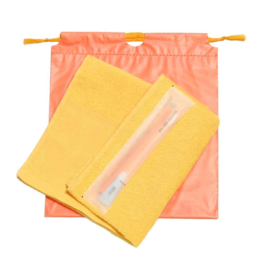 180匁平地付ソフトタオル・国産ハブラシセット（オレンジ）巾着袋入り　200セット